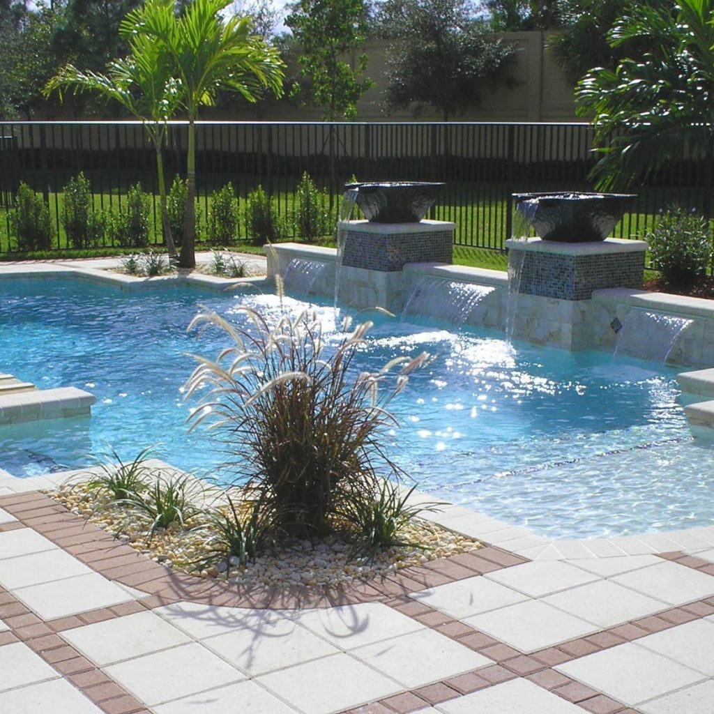 Pool with raised water bowls, sheer waterfalls and a fountain planter